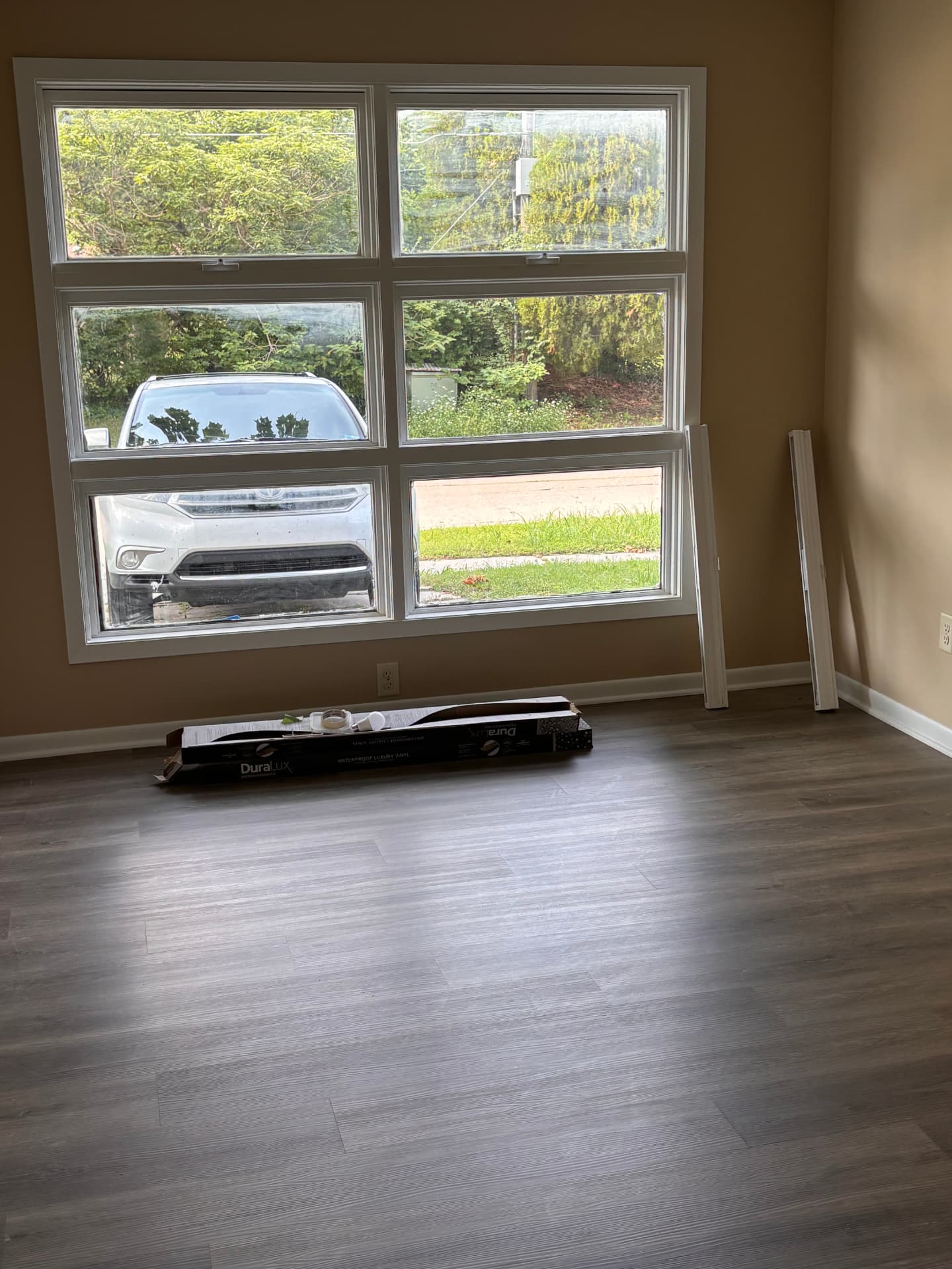 Rental unit with new LVP flooring, fresh paint, and a new window